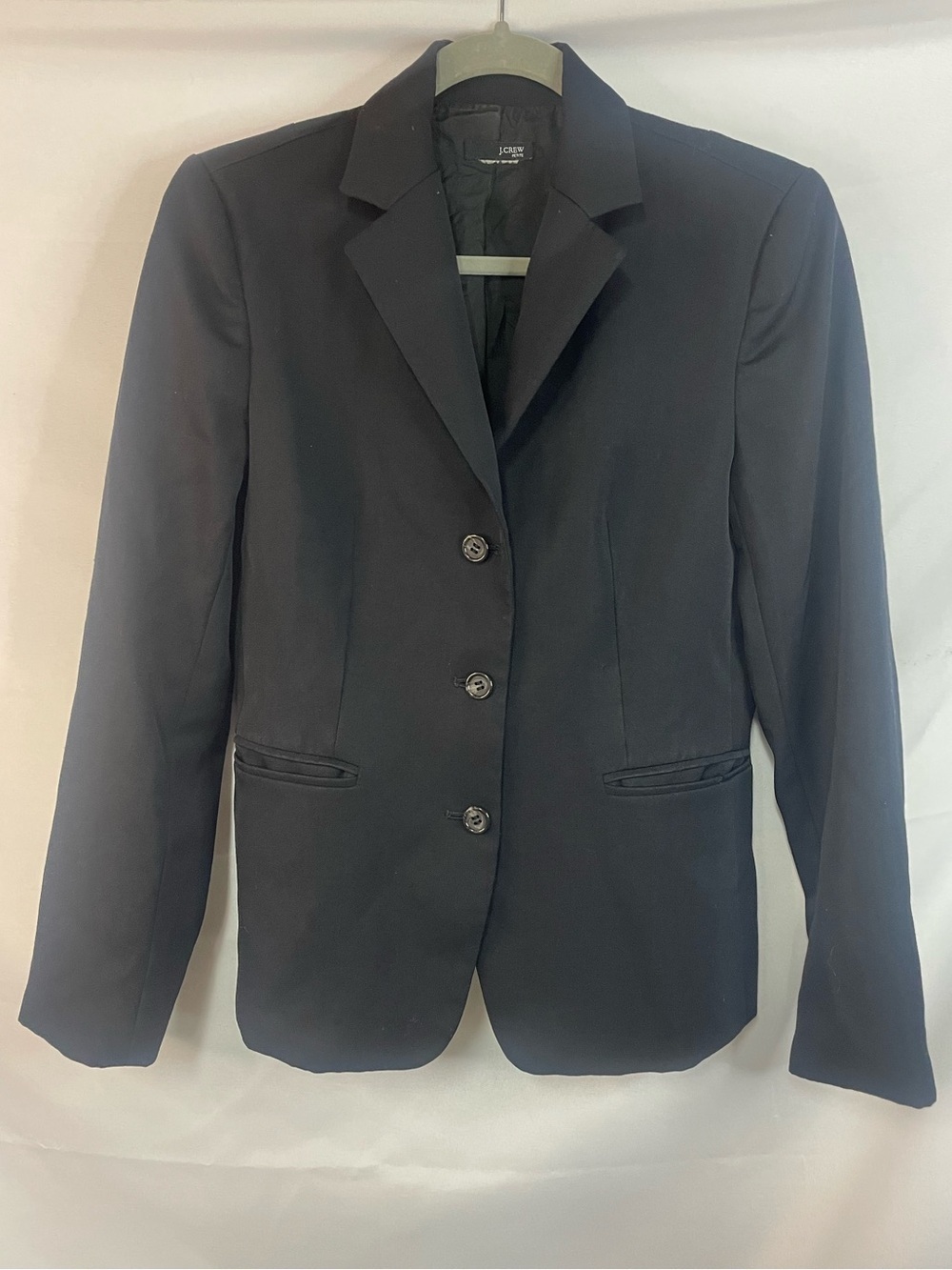 J Crew women’s petite black blazer. Simple clean lines. Tag has been removed.